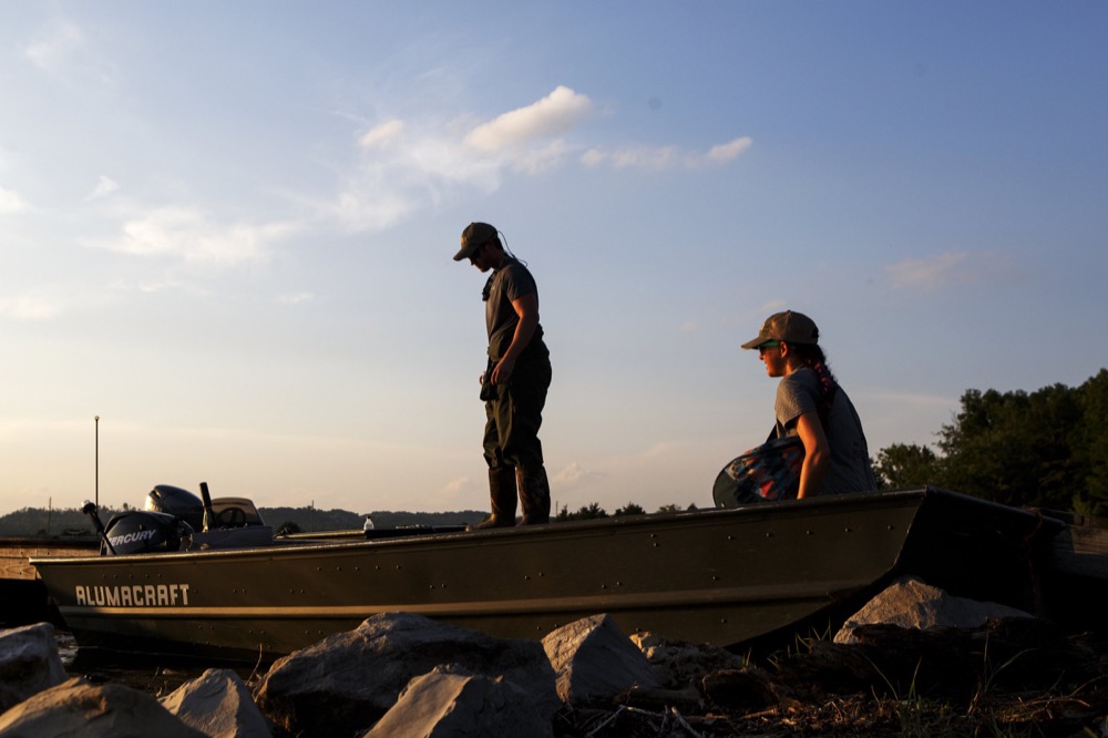 TWRA Wildlife Manager Daniel Istvanko, center, and TWRA intern Janzen Velba wait before heading out to Nickajack Cave to count gray bats on Wednesday, June 19, 2019 in Marion County, Tenn. Gray bats are federally endangered and afforded protection under the Endangered Species Act.
