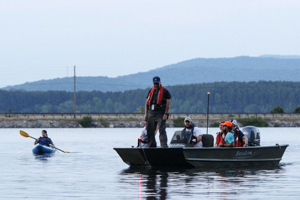 TVA Watershed Representative Mark Odom stands in the bow of a boat as he arrives with a group at the opening of Nickajack Cave to help count bats on Wednesday, June 19, 2019 in Marion County, Tenn. Gray bats are federally endangered and afforded protection under the Endangered Species Act.
