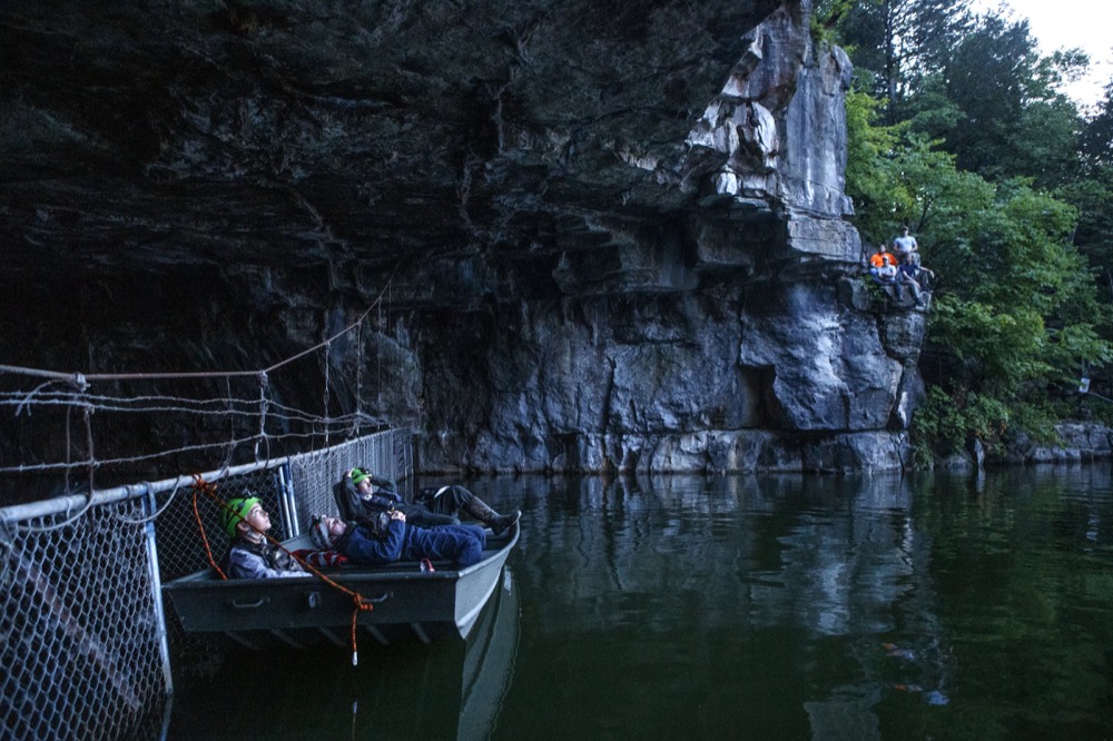 Laying back in a boat, TWRA intern Janzen Velba, left, TVA Terrestrial Zoologist Liz Hamrick and TWRA Wildlife Manager Daniel Istvanko help count bats as they exit Nickajack Cave on Wednesday, June 19, 2019 in Marion County, Tenn. Gray bats are federally endangered and afforded protection under the Endangered Species Act.