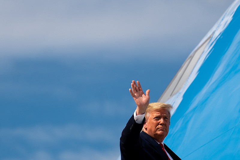 President Donald Trump waves while boarding Air Force One at Joint Base Andrews in Maryland on Tuesday. Administration officials are briefing Congress on what they say are ties between Iran and Al Qaida. (Erin Schaff/The New York Times)