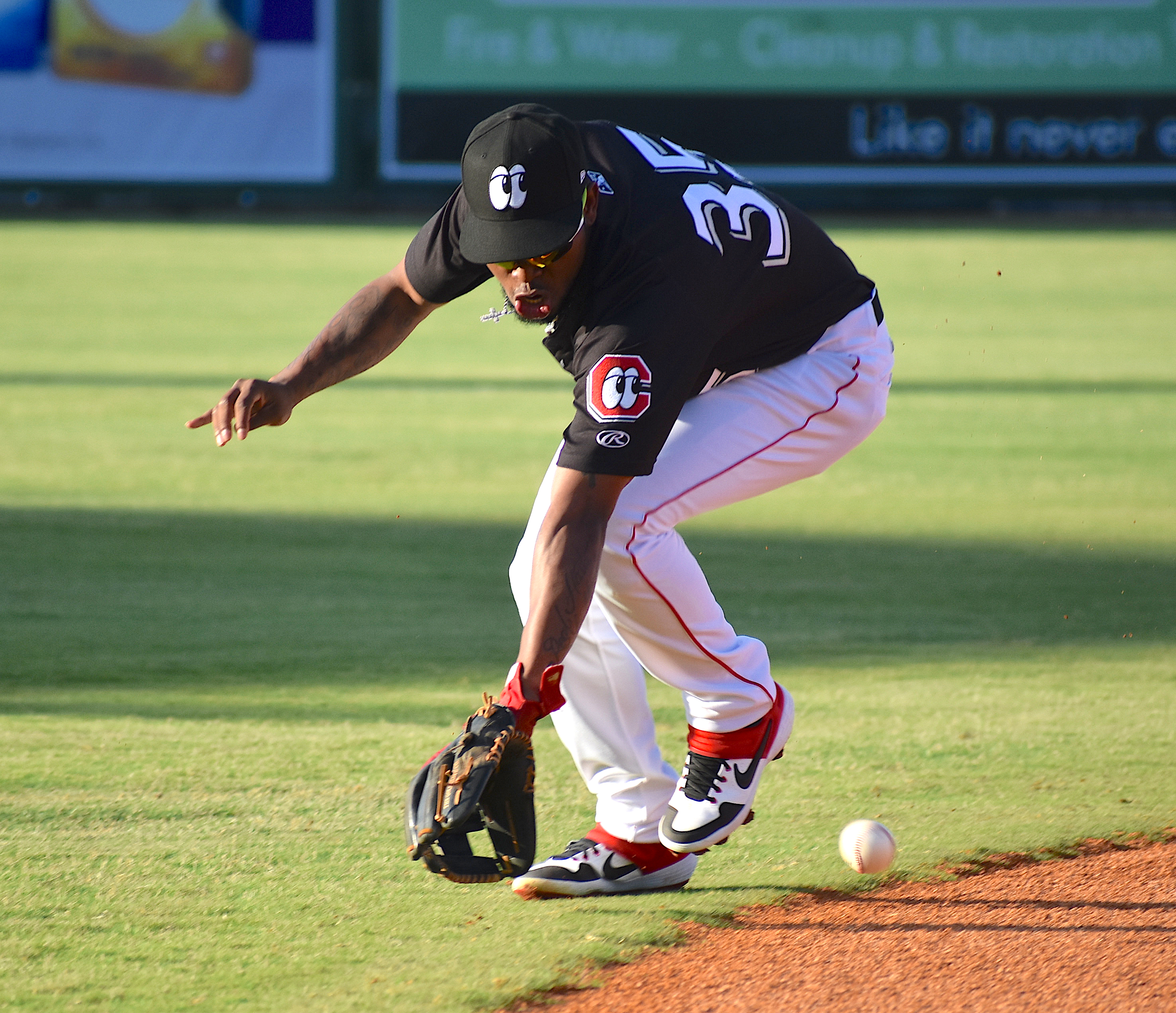 Chattanooga Lookouts shortstop Alfredo Rodriguez makes a play in the hole to throw out a Birmingham Baron in the first inning at AT&T Field on Thursday night. Rodriguez helped key the Lookouts' 10-9 victory over the Barons.