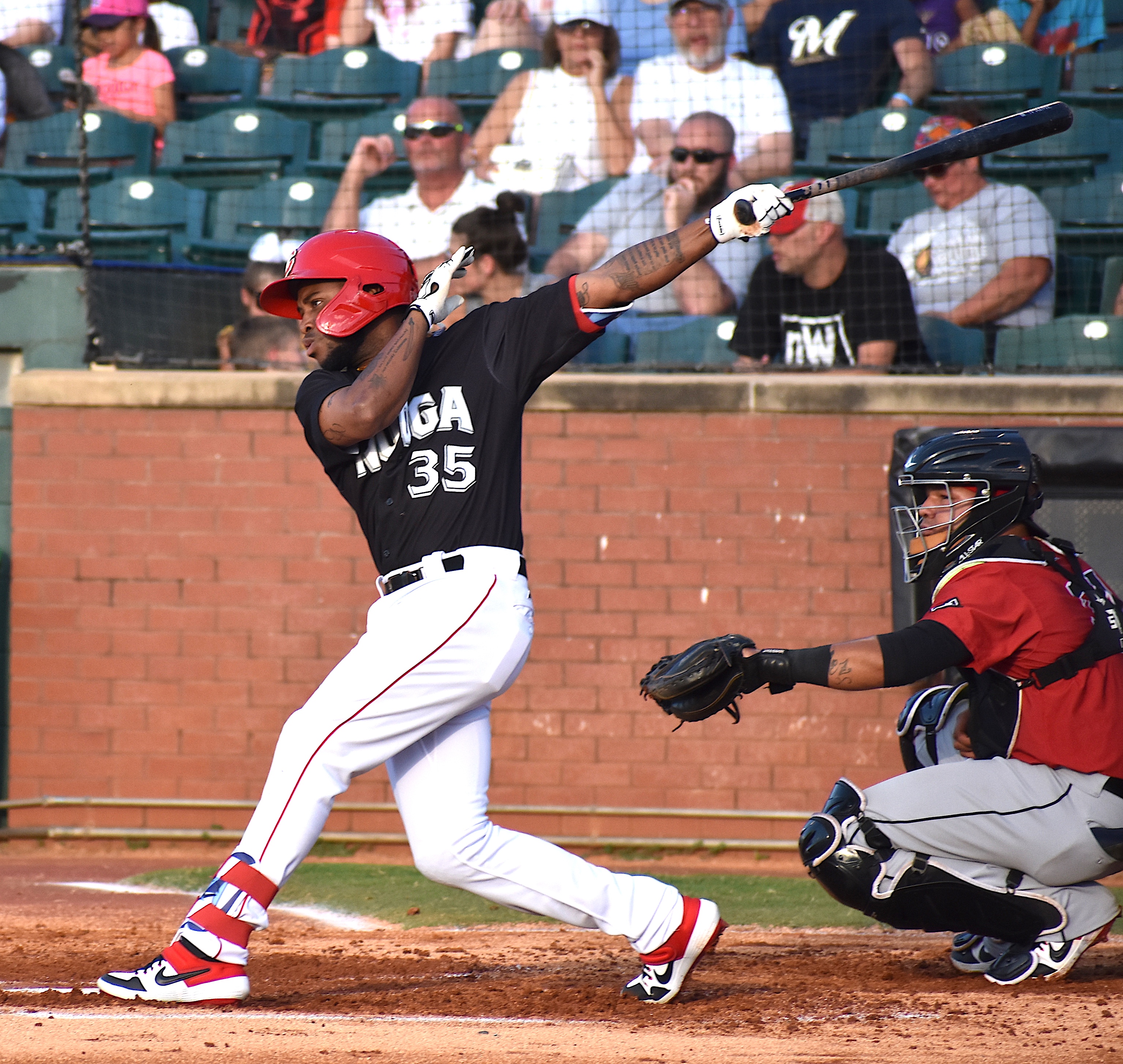 Chattanooga Lookouts leadoff hitter Alfredo Rodriguez follows through on a single in the first inning against Birmingham at AT&T Field on Thursday. Rodriguez leads the team with a .308 batting average.