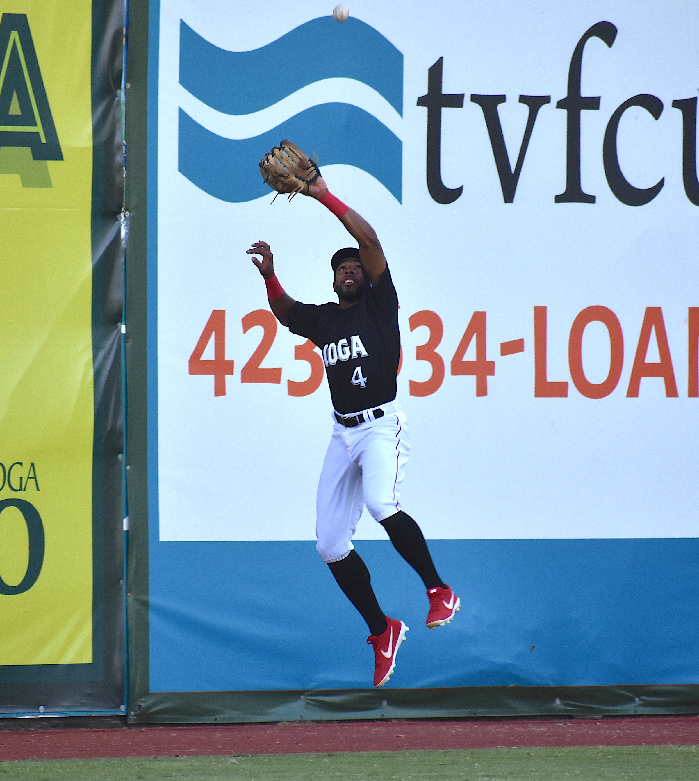 Chattanooga Lookouts left fielder Narciso Crook makes a leaping catch at the warning track in Thursday's 10-9 Southern League win over Birmingham at AT&T Field.