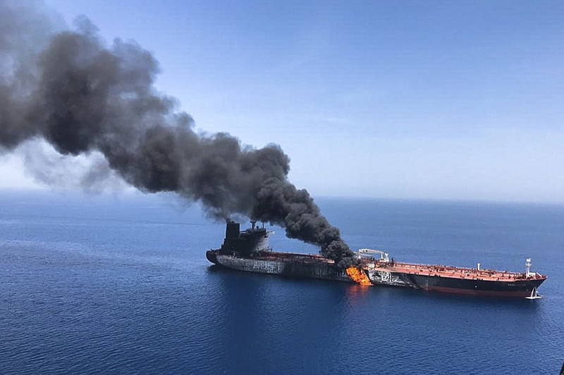 In this Thursday, June 13, 2019 file photo, an oil tanker is on fire in the sea of Oman. A series of attacks on oil tankers near the Persian Gulf has ratcheted up tensions between the U.S. and Iran -- and raised fears over the safety of one of Asia s most vital energy trade routes, where about a fifth of the world s oil passes through its narrowest at the Strait of Hormuz. The attacks have jolted the shipping industry, with many of operators in the region on high alert. (AP Photo/ISNA, File)