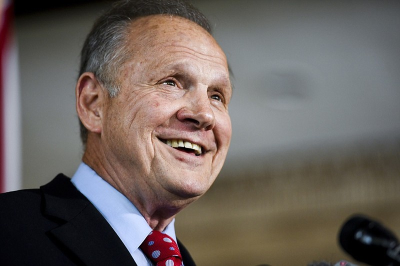 Former Alabama Chief Justice Roy Moore smiles as he announces his run for the republican nomination for U.S. Senate, Thursday, June 20, 2019, in Montgomery, Ala. (AP Photo/Julie Bennett)