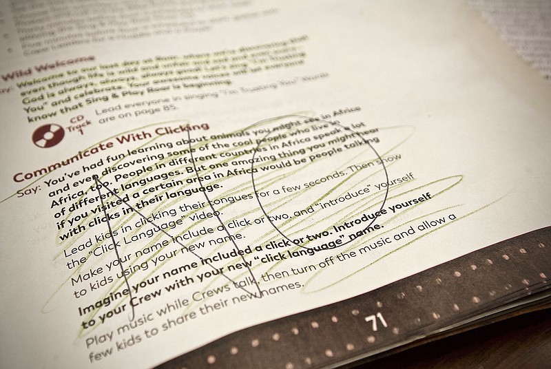 A crossed-out excerpt from a Vacation Bible School curriculum is seen in this photo. 
