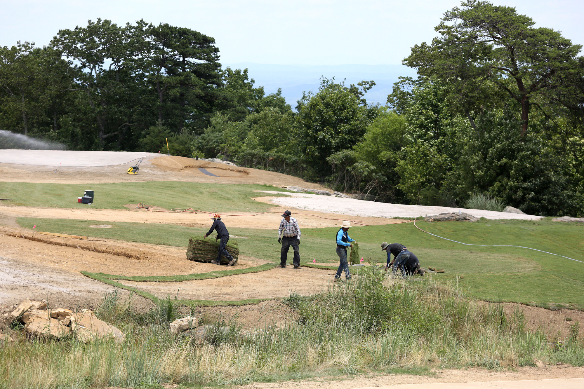 Grass is placed on a portion of The Course at McLemore on Lookout Mountain Friday, June 21, 2019 in Walker County, Ga. McLemore is planned to be a major branded, upper upscale/luxury resort, conference center with a mountaintop golf course and spa.