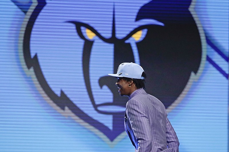 Former Murray State point guard Ja Morant walks on stage after being selected with the second pick overall by the Memphis Grizzlies during the NBA draft Thursday night in New York. 