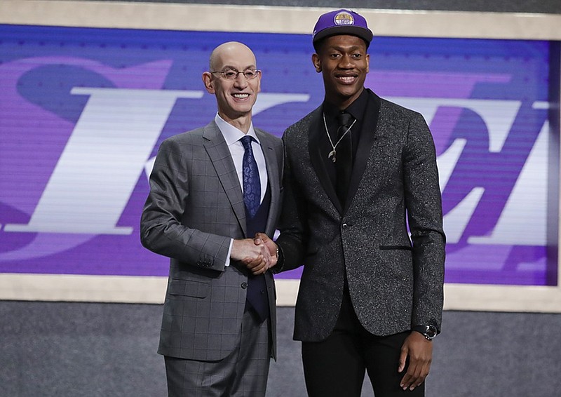 Former University of Virginia standout De'Andre Hunter, right, is greeted by NBA commissioner Adam Silver after being drafted fourth overall by the Los Angeles Lakers on Thursday night in New York. Hunter will actually play for the Atlanta Hawks as part of a deal involving the New Orleans Pelicans.