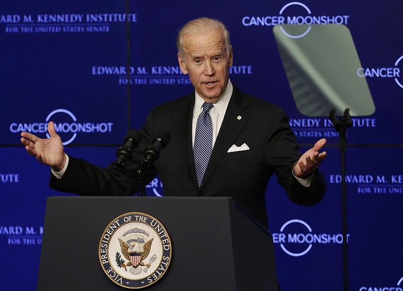 FILE - In this Oct. 18, 2016 file photo, Vice President Joe Biden speaks at the Edward M. Kennedy Institute for the United States Senate in Boston, about the White House's cancer "moonshot" initiative — a push to throw everything at finding a cure within five years. Biden’s defining venture since leaving the Obama White House is the Biden Cancer Initiative, a nonprofit aimed at speeding a cancer cure in memory of his son. (AP Photo/Elise Amendola)