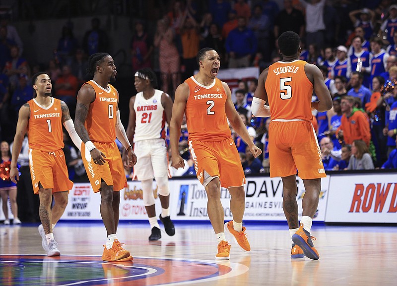 Tennessee's Grant Williams (2) and fellow junior Jordan Bone (0) celebrate after senior Admiral Schofield (5) made a 3-point shot against Florida in the final minute of their Jan. 12 game in Gainesville. All three were drafted by NBA teams Thursday night.