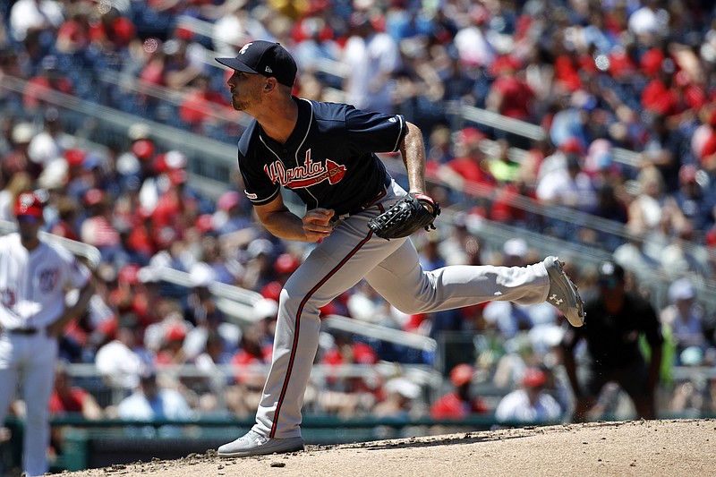Atlanta Braves reliever Josh Tomlin pitches to the Washington Nationals during the third inning of Sunday's game in Washington.