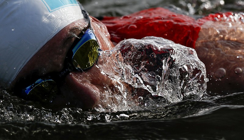 Henry Kannapell swims in the Tennessee River during the Chattanooga Waterfront Triathlon on Sunday, June 23, 2019 in Chattanooga, Tenn. Kannapell competed in the Olympic-distance event. The Olympic distance consists of a 1.5 kilomter swim, 4-kilometer bike ride and 10-kilometer run.  / Staff photo by C.B. Schmelter
