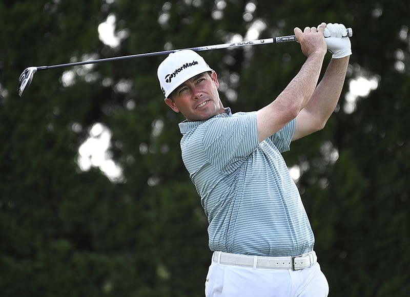 Chez Reavie hits off the ninth tee at TPC River Highlands during the final round of the Travelers Championship on Sunday in Cromwell, Conn.