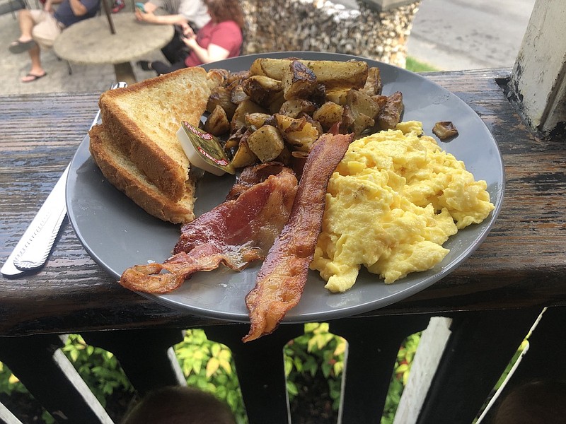 The Eggs & Bacon breakfast at Aretha Frankensteins comes with three eggs, three pieces of Applewood-smoked bacon, choice of biscuit or toast and choice of fried potatos or grits for $7.75./ Photo by Jim Tanner