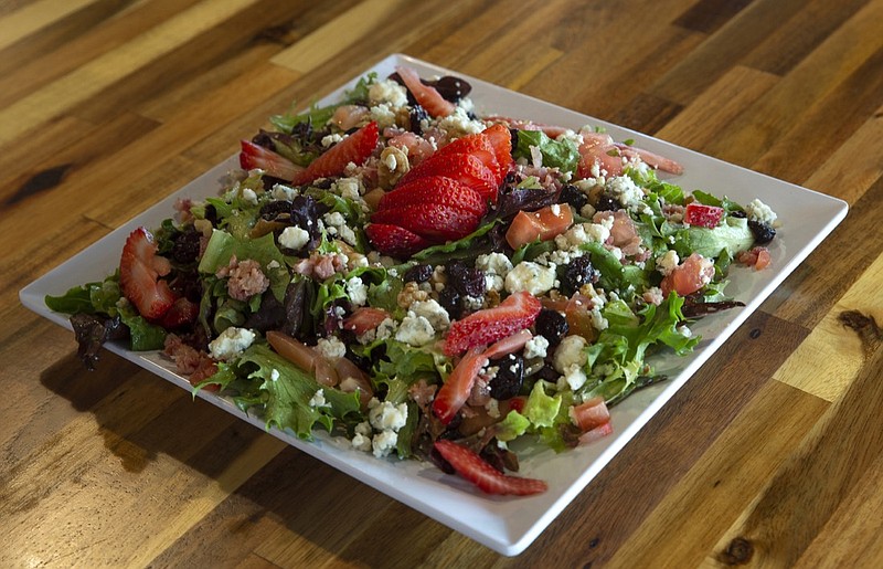 Blue Cheese Walnut Salad - Mixed baby greens dried cranberries, walnuts blue cheese crumbles, bacon, tomatoes and strawberries tossed in a balsamic walnut vinaigrette. / David Humber