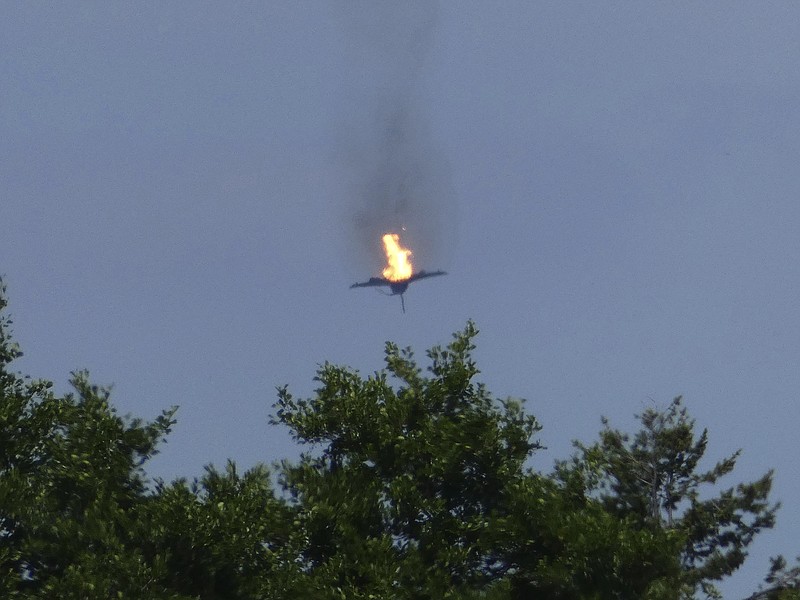 A burning Eurofighter airplane crashes down near the village Malchow in norther Germany, Monday, June 24, 2019. The two unarmed fighter jets collided on Monday near Lake Mueritz, 100 kilometers ,62 miles, north of Berlin. ( Thomas Steffan/dpa via AP)
