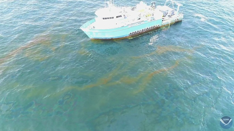 This September 2018 photo provided by NOAA shows a NOAA research vessel at a Taylor Energy production site in the Gulf of Mexico. A new federally led study of oil seeping from a platform toppled off Louisiana's coast 14 years ago found releases lower than other recent estimates, but contradicts the well owner's assertions about the amount and source of oil. (NOAA via AP)