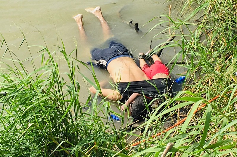 The bodies of Salvadoran migrant Oscar Alberto Mart nez Ram rez and his nearly 2-year-old daughter Valeria lie on the bank of the Rio Grande in Matamoros, Mexico, Monday, June 24, 2019, after they drowned trying to cross the river to Brownsville, Texas. Martinez' wife, Tania told Mexican authorities she watched her husband and child disappear in the strong current. (AP Photo/Julia Le Duc)

