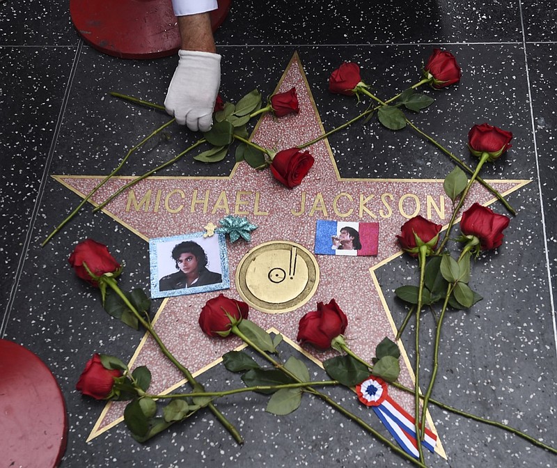 Roses adorn the Hollywood Walk of Fame star belonging to the late pop star Michael Jackson on the 10th anniversary of his death, Tuesday, June 25, 2019, in Los Angeles. (Photo by Chris Pizzello/Invision/AP)