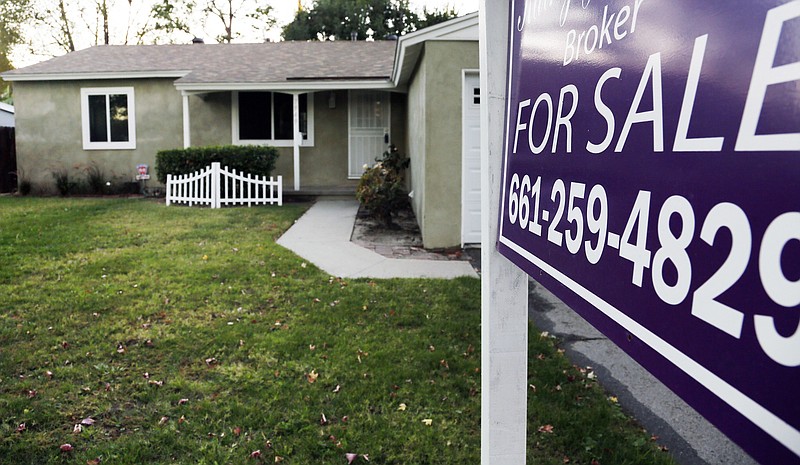 This Monday, Nov. 3, 2014 photo shows a a house for sale in Los Angeles. Freddie Mac, the mortgage company, releases weekly mortgage rates on Thursday, Nov. 13, 2014. (AP Photo/Richard Vogel)