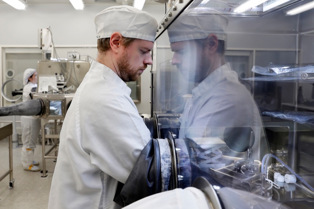 Jeremy Kent, Apollo sample curation processor, works with lunar samples within a sealed, nitrogen pressurized examination case inside the lunar lab at the NASA Johnson Space Center Monday, June 17, 2019, in Houston. The samples are always kept inside a nitrogen pressurized environment to prevent decay and degradation, even as they are moved between the lab and the storage vault. (AP Photo/Michael Wyke)