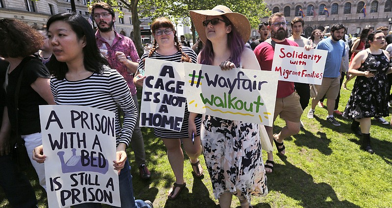 Employees of Wayfair march to Copley Square in protest prior to their rally in Boston, Wednesday, June 26, 2019. Employees at online home furnishings retailer Wayfair walked out of work to protest the company's decision to sell $200,000 worth of furniture to a government contractor that runs a detention center for migrant children in Texas. (AP Photo/Charles Krupa)