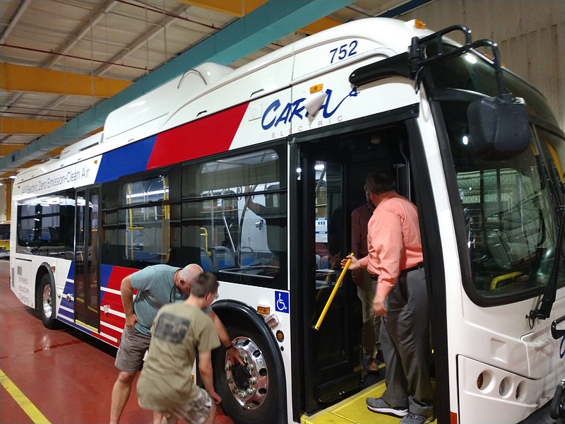 One of CARTA's new electric buses are checked out on Wednesday by a group led by the East Tennessee Clean Fuels Coalition. / Staff photo by Mike Pare