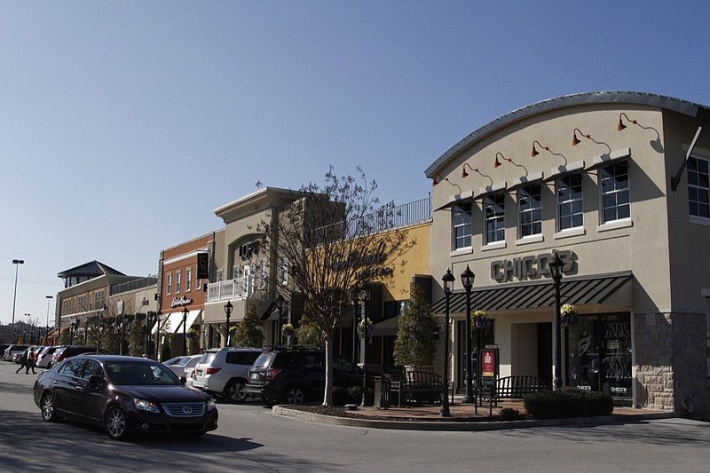 Shoppers visit the Hamilton Corner lifestyle center off Gunbarrel Road in this 2015 staff file photo.