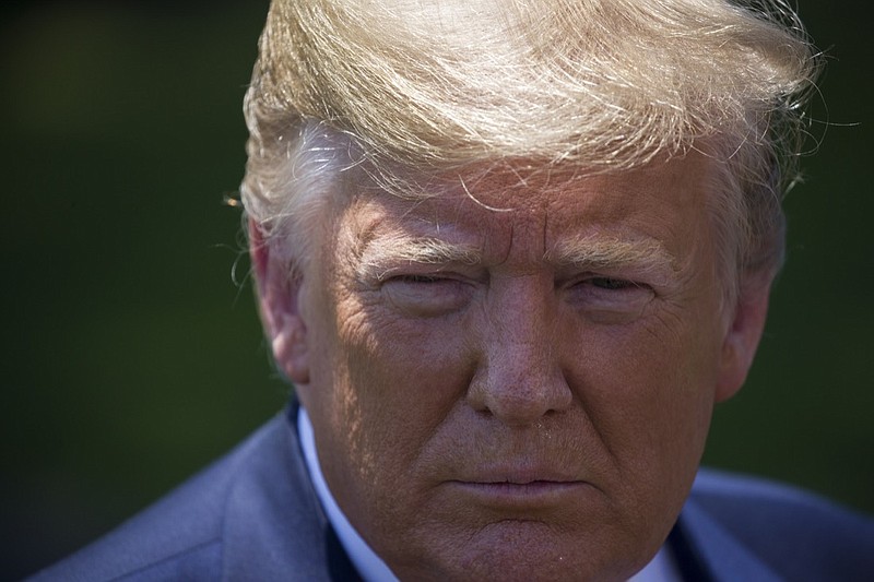 President Donald Trump listens to a question as he speaks with reporters on the South Lawn of the White House, Wednesday, June 26, 2019, in Washington. Trump is en route to Japan for the G-20 summit. (AP Photo/Alex Brandon)