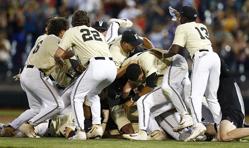 Vanderbilt players celebrate after defeating Michigan in Game 3 of the College World Series finals Wednesday night in Omaha, Neb.