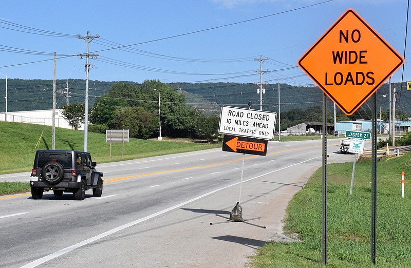 A Jeep Wrangler heads north from Chattanooga on U.S. Highway 41 on Thursday, June 27, 2019, where a state slide repair project and problems with its lone open traffic lane forced a temporary closure until July 4. The closure is in place till next week while crews build temporary roads around the shifting traffic lane.