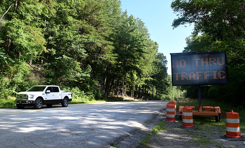 A Ford F-150 travels south on U.S. Highway 41 on Thursday, June 27, 2019, where a state slide repair project and problems with its lone open traffic lane forced a temporary closure until July 4. The closure is in place till next week while crews build temporary roads around the shifting traffic lane.
