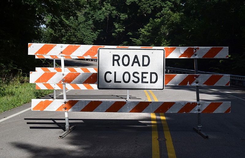 A road closed sign stands across U.S. Highway 41 on Thursday, June 27, 2019, where a state slide repair project and problems with its lone open traffic lane forced a temporary closure until July 4. The closure is in place till next week while crews build temporary roads around the shifting traffic lane.