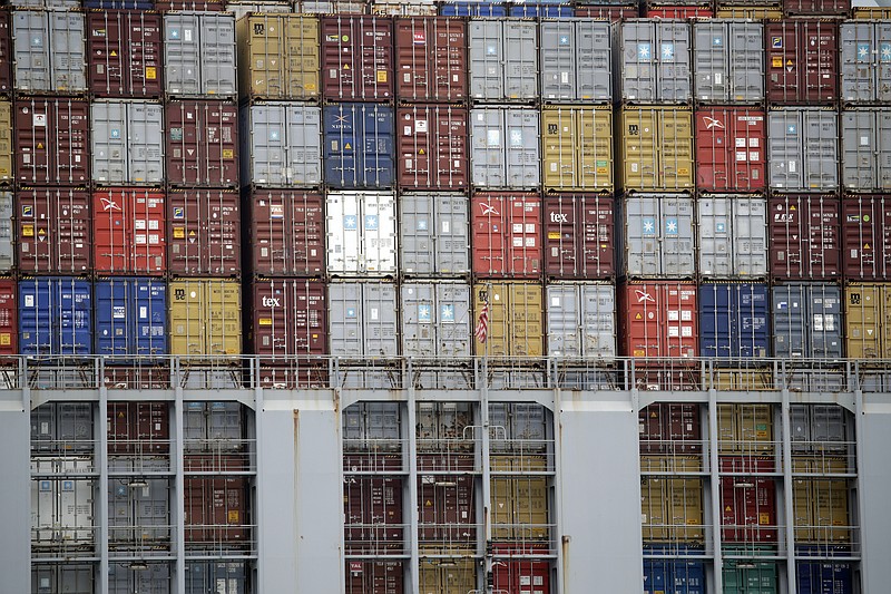 FILE - In this June 19, 2019, file photo cargo containers are stacked on a ship at the Port of Los Angeles in Los Angeles. On Thursday, June 27, the Commerce Department issues the third and final estimate of how the U.S. economy performed in the January-March quarter. (AP Photo/Marcio Jose Sanchez, File)