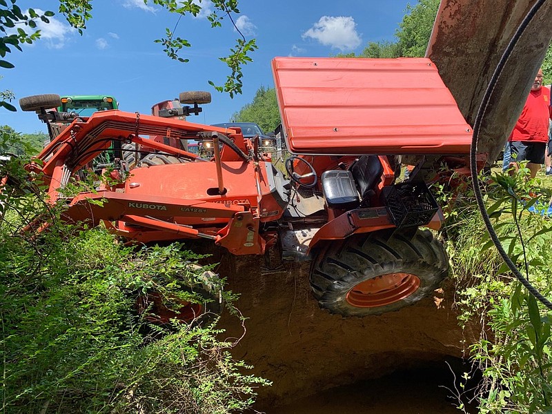An 82-year-old farmer was rescued after his tractor fell into a sinkhole in Meigs County on Wednesday, June 26, 2019. / Photo from Facebook post on Meigs County Emergency Services page
