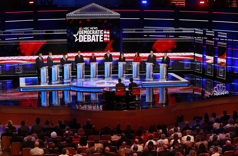 Democratic presidential candidates from left, New York City Mayor Bill de Blasio, Rep. Tim Ryan, D-Ohio, former Housing and Urban Development Secretary Julian Castro, Sen. Cory Booker, D-N.J., Sen. Elizabeth Warren, D-Mass., former Texas Rep. Beto O Rourke, Sen. Amy Klobuchar, D-Minn., Rep. Tulsi Gabbard, D-Hawaii, Washington Gov. Jay Inslee, and former Maryland Rep. John Delaney listen to a question during the Democratic primary debate hosted by NBC News at the Adrienne Arsht Center for the Performing Arts, Wednesday, June 26, 2019, in Miami. (AP Photo/Wilfredo Lee)