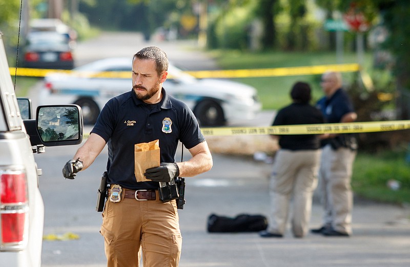 Investigators work the scene of a shooting in the 1500 block of Bradt Street on Thursday, June 27, 2019, in Chattanooga, Tenn. 