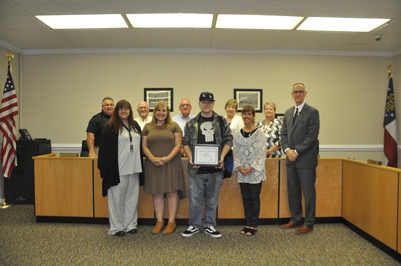 Zachary Frazier, center, accepts his award from the Walker County Board of Education. / Photo contributed by Dorothy Patterson