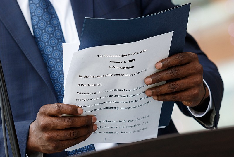 Wade Hinton reads Abraham Lincoln's Emancipation Proclamation during a Juneteenth Celebration in Miller Park on Wednesday, June 19, 2019, in Chattanooga, Tenn. Juneteenth commemorates the abolition of slavery in the United States on June 19, 1865.