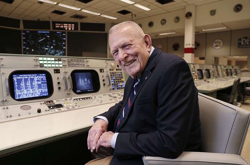 Gene Kranz, aerospace engineer, fighter pilot, an Apollo-era flight director and later director of NASA flight operations, sits at the console where he worked during the Gemini and Apollo missions at the NASA Johnson Space Center Monday, June 17, 2019, in Houston. "The impact is incredible," Kranz, 85, said. With all the vacated seats, the room reminded him of a shift change when flight controllers would hit the restroom. "So this room is now empty and it's soon going to be filled and all of a sudden, the energy that this room possesses is going to start enveloping the environment here." (AP Photo/Michael Wyke)