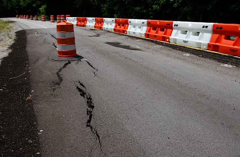 Staff photo by Doug Strickland / A portion of Lake Resort Drive is reduced to a single lane following damage to the roadway, seen here on Thursday, May 23, 2019, in Chattanooga, Tenn.