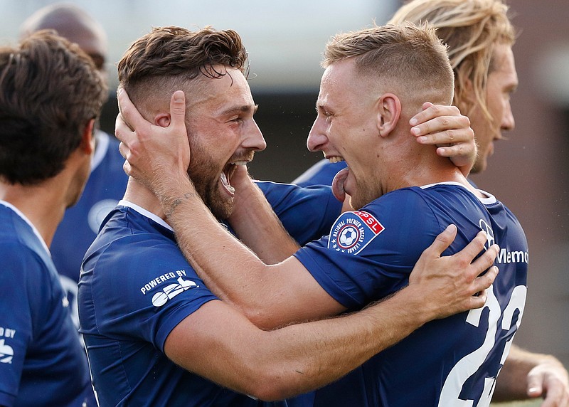 Chattanooga FC teammates Alun Webb, left, and Mason Walsh celebrate Webb's goal during Saturday night's soccer match against Asheville City SC at Finley Stadium.