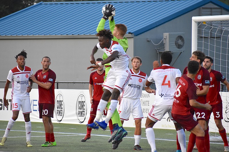 Chattanooga Red Wolves SC goalkeeper Alex Mangels makes a leaping save against the Richmond Kickers in Saturday's USL League One match at Chattanooga Christian School's David Stanton Field. The Red Wolves won 1-0 and are 5-0-2 at home.