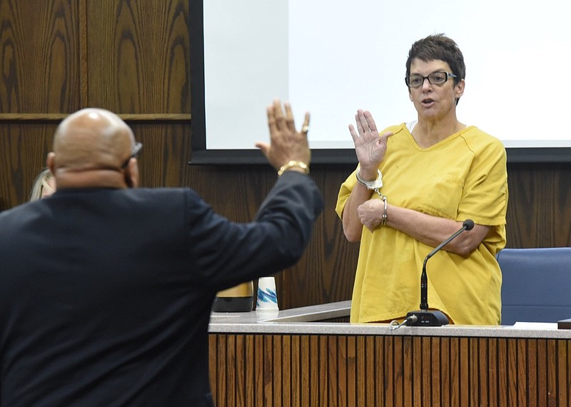 Staff photo by Tim Barber /
Janice Hinds takes the oath as she takes the stand concerning her bond revocation for alcohol use detection Monday in Judge Don Poole's courtroom.