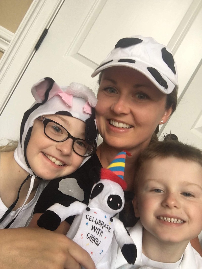 Roanna Taphorn, center, with children Amelia, left, and Joseph, says they have participated in five Cow Appreciation Days. / Taphorn Contributed Photo