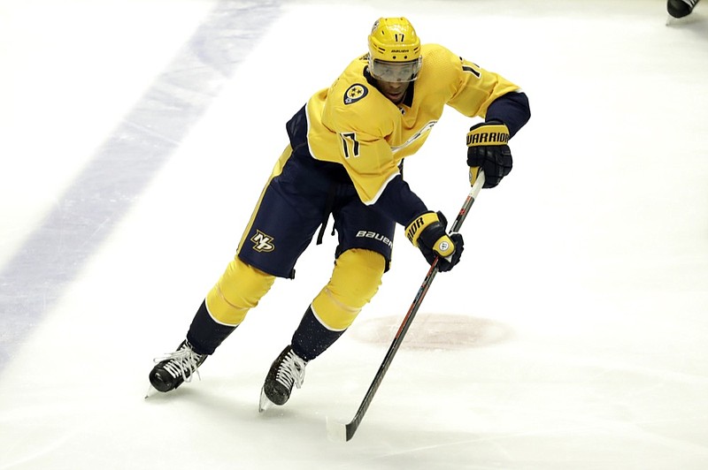 FILE - In this March 5, 2019 file photo Nashville Predators forward Wayne Simmonds plays against the Minnesota Wild in the third period of an NHL hockey game in Nashville, Tenn. The New Jersey Devils added Simmonds in free agency on Monday, July 1, 2019 agreeing to a $5 million, one-year contract with the physical winger. Simmonds, who turns 31 in August, played for Philadelphia and Nashville last season, finishing with 17 goals and 13 assists in 79 games. He also made two playoff appearances with the Predators. (AP Photo/Mark Humphrey, file)