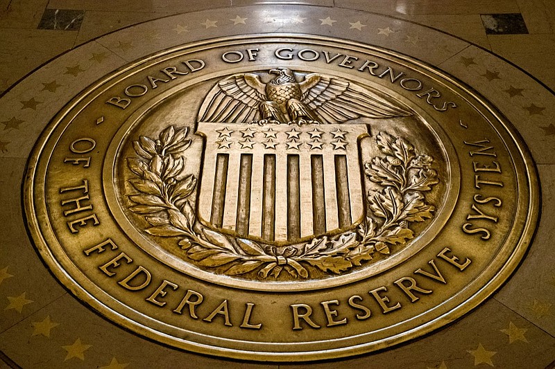 This Feb. 5, 2018, file photo shows the seal of the Board of Governors of the United States Federal Reserve System in the ground at the Marriner S. Eccles Federal Reserve Board Building in Washington. President Donald Trump says on Twitter he will nominate economists Christopher Waller and Judy Shelton to fill two vacancies on the Federal Reserve Board of Governors. (AP Photo/Andrew Harnik, File)