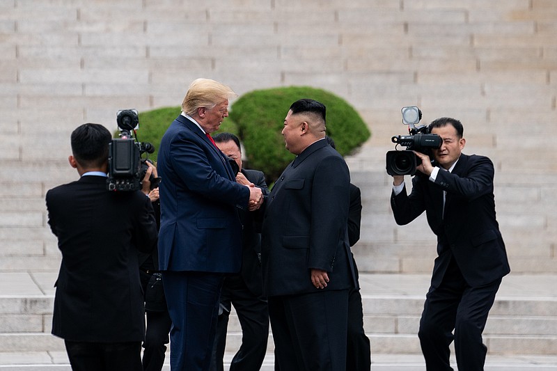 President Donald Trump shakes hands with Kim Jong Un, the North Korean leader, on the North Korean side of the Demilitarized Zone at Panmunjom, on June 30, 2019. (Erin Schaff/The New York Times)