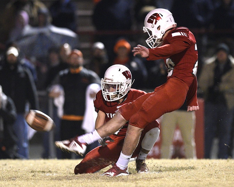 Whitwell's Evan Nunley kicks the winning field goal alongside holder Jaren Thames during the Tigers' Class 1A state semifinal victory against visiting Greenback in November 2018. 